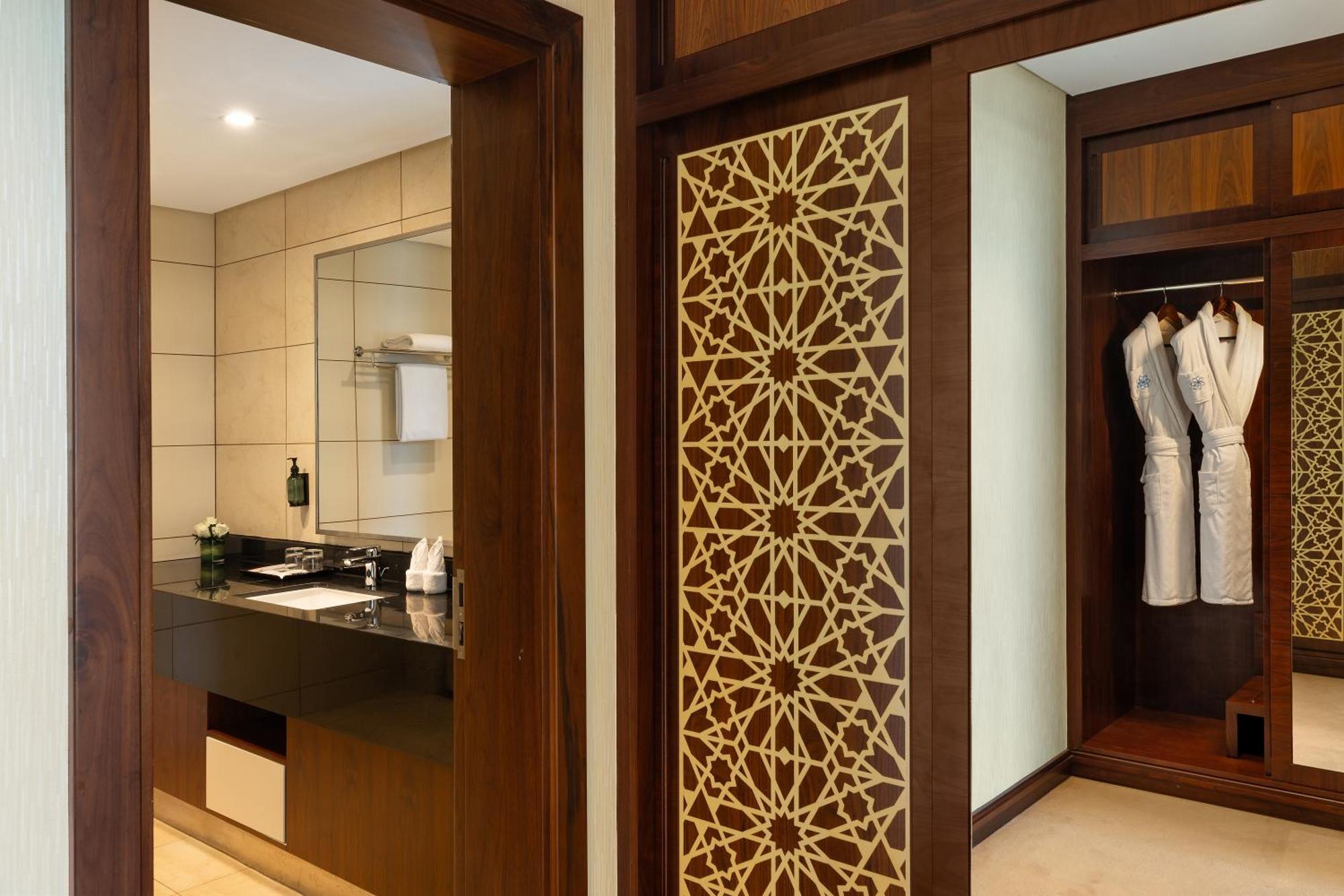 Royal Continental Suites Business Bay Dubai Exterior photo A sliding door with a decorative panel