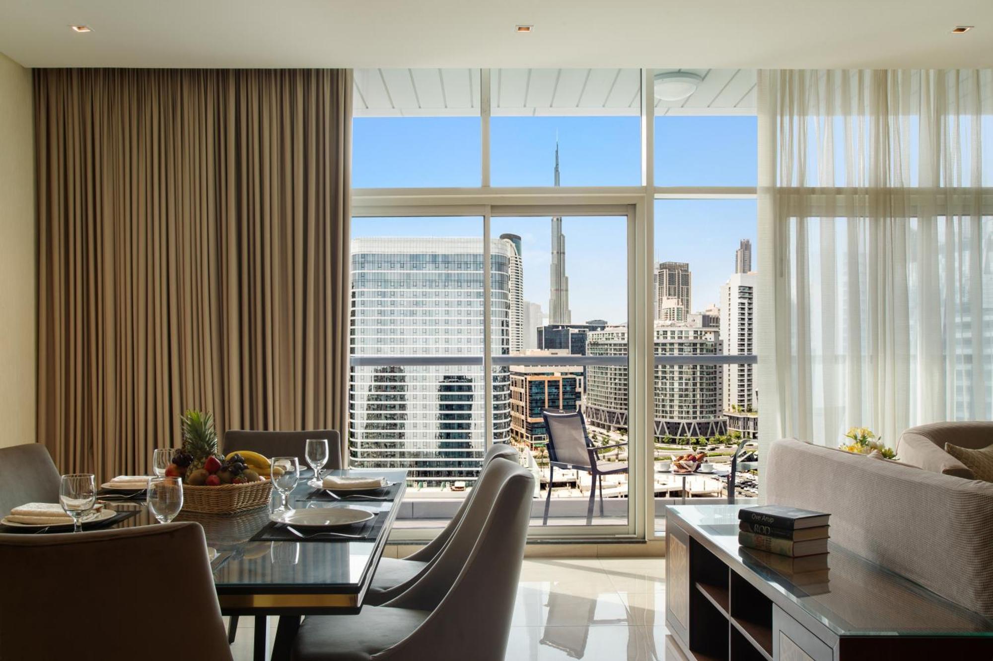 Royal Continental Suites Business Bay Dubai Exterior photo A view of the CN Tower from a suite at the Four Seasons Hotel