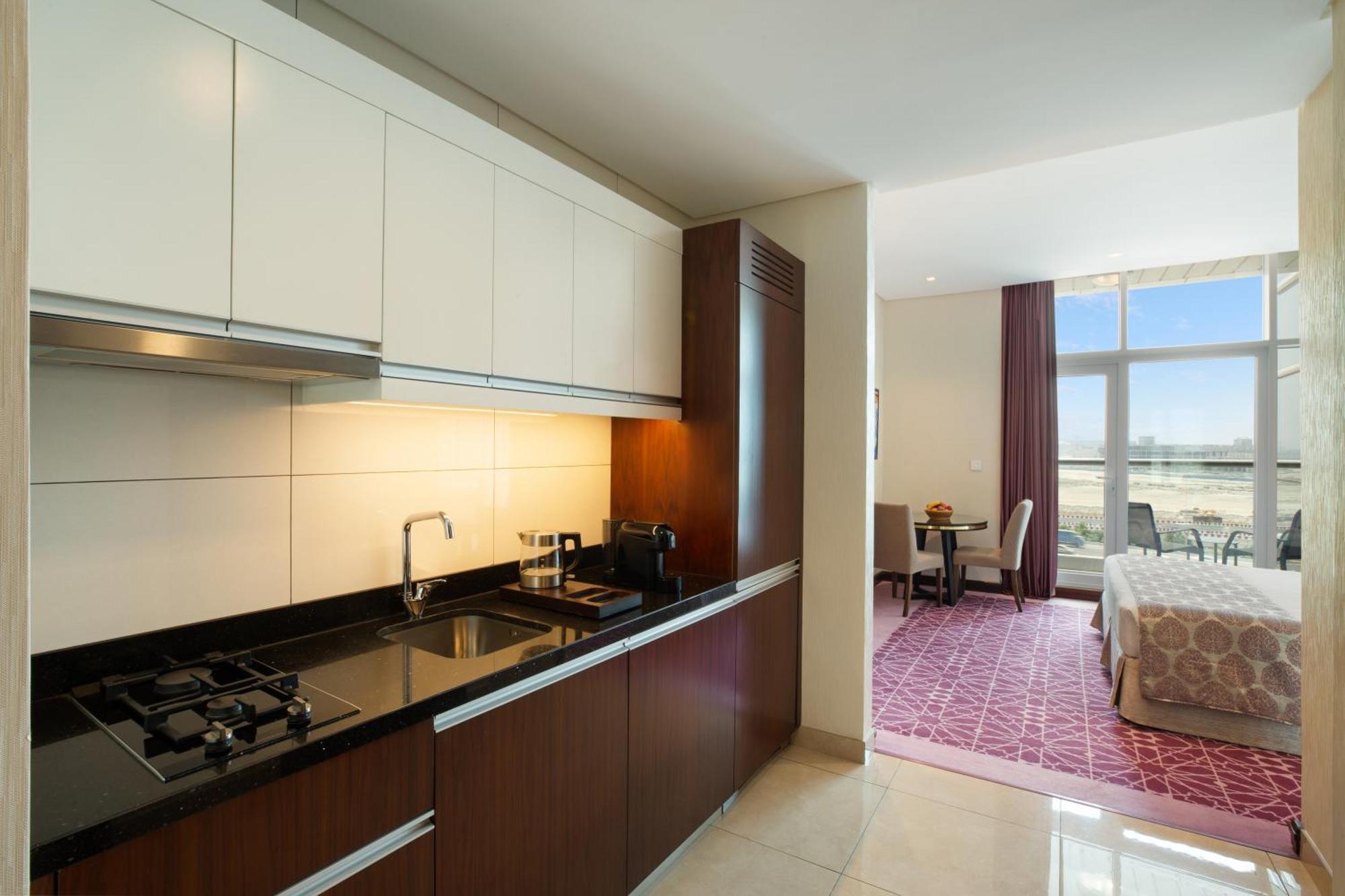 Royal Continental Suites Business Bay Dubai Exterior photo A kitchen in a suite at the Jumeirah Emirates Towers Hotel